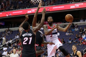 Oct 4, 2016; Washington, DC, USA; Washington Wizards forward Markieff Morris (5) leaps to pass the ball as Miami Heat center Hassan Whiteside (21) defends in the third quarter at Verizon Center. the Heat won 106-95. Mandatory Credit: Geoff Burke-USA TODAY Sports